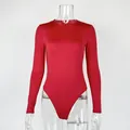 Women's slim fit red long sleeve bodysuit featuring a crew neck and stretchy fabric. - S / Tops / Red