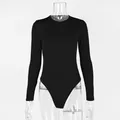 Solid black long sleeve bodysuit on transparent mannequin for women's casual wear. - S / Tops / Black