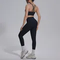 Back view of black two-piece yoga set featuring criss-cross back bra and high waist leggings. - S / Top And Bottom / Black