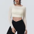 Detail shot of cream mesh long sleeve fake two-piece yoga crop top for fitness training - S / Tops / Light Ivory