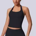 Detailed view of black seamless halter-neck sports tank top for fitness and yoga wear. - S / Tops / Black