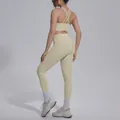 Back view of beige cross-back sports bra and high-waisted leggings set for yoga and fitness - S / Top And Bottom / Khaki