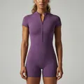 Front view of a purple zip-up short sleeve yoga bodysuit with slim fit design - S / Top And Bottom / Purple