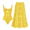 Detailed macro view of the yellow laser-cut eyelet floral pattern on this swimwear set - S / Top And Bottom / Yellow