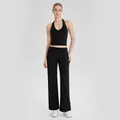 Zwarte halter yoga set met wijde broek voor pilates en fitness sport trainingen - S / Top en Broek / Zwart