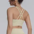Detailed back view of a beige criss-cross strap sports bra for yoga and gym workout - S / Tops / Khaki