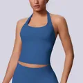 Close-up of seamless blue halter sports bra showing athletic fit and ribbed fabric. - Blue Gray