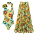 Detailed view of sunflower print one-piece swimsuit set with matching sheer maxi beach skirt - S / Top And Bottom / One Shoulder Set / Sky Blue
