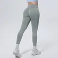 Back view detail of seamless high-waisted washed yoga leggings in sage green for women - Freedom Grey