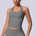 Detail shot of a grey halter neck seamless sports tank top with a tight fit for yoga. - Dark Gray