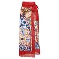 Detailed view of a vibrant ethnic majolica print wrap sarong with an elegant red bow tie waist. - One Size / Bottoms / Majolica Print Red Trim