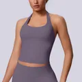 Purple seamless halter neck sports bra for yoga and fitness with a sleek open back design - Truffle
