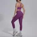 Back view of purple cross-back sports bra and matching yoga leggings set for women - Magenta Purple
