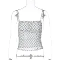 Detail view of slim fit white camisole top with black polka dot print and ruffled bust - S / Tops / White