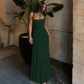 Detailed view of an elegant dark green sleeveless evening gown with ruched waist design - Dark Green