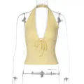 Detail view of yellow halter top with deep V-neck and delicate lace trim - S / Tops / Yellow