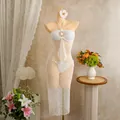 Detailed view of elegant white crochet beach cover-up set with sun buckle on mannequin - S / Top And Bottom / White
