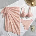 Overhead view of a three-piece pink lace bikini set with matching beach sarong skirt - S / Top And Bottom / Pink