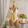 Detailed view of pale yellow floral textured tankini swimsuit displayed on a mannequin - S / Top And Bottom / Yellow