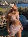 Close-up of pink lace bikini three-piece set worn by a model at a beach resort - S / Top And Bottom / Pink