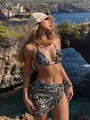 Sexy three-piece bikini set featuring abstract floral print and matching beach sarong skirt - S / Top And Bottom / Black