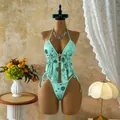 Detailed view of a mint green sequin floral bikini set displayed on a mannequin - S / Top And Bottom / Emerald Green Floral