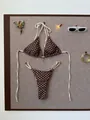 Two-piece polka dot bikini set with cream tie straps on a textured flat lay background - S / Top And Bottom / Brown