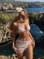 Full body view of floral embroidered pink 3-piece bikini set with sequins and a mesh beach sarong. - S / Top And Bottom / Pink