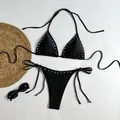 Detailed shot of sexy black halter bikini set featuring cool silver metal rivet accents on edges - S / Top And Bottom / Black