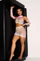 Detailed view of a colorful tie-dye fishnet mesh three-piece outfit on a model posing. - XL / Top And Bottom / Pink Yellow Tie Dye