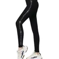 Close-up detail of shimmering rhinestone star patterns on the side of black winter leggings - Rhombus Star Rhinestone