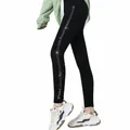 Close-up detail of high-waisted black fleece-lined leggings with sparkling rhinestone side stripes - Vertical Stripe Rhinestone