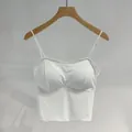 Front view of white seamless camisole with built-in chest pads on a wooden hanger - Tops / Thin Cup (1.5cm) / White