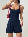 Close-up of navy blue square neck romper featuring ruched waist and wide leg shorts - XS / Top And Bottom / Navy Blue