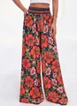 Sommerliche weit geschnittene Hose mit Blumenprint und hoher Taille. - S / Unterteile / Schwarz mit rotem Blumendruck