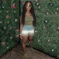Model wearing a women's olive green racerback tank and gradient shorts 2-piece set - Army Green