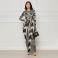 Elegant long-sleeved bodycon maxi dress featuring irregular black and white abstract print. - S / Bottoms / Black