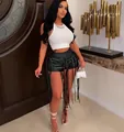 Sexy zwarte PU-lederen franjeshort met ingewikkelde vetersluiting en lage taille design - S / Bottoms / Zwart