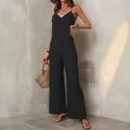 Chic black sleeveless strap jumpsuit featuring a loose wide-leg fit for a casual summer style. - S / Top And Bottom / Black
