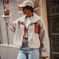 Close-up side view of women's cream fleece jacket featuring brown leather patchwork details - 2XL / Tops / Apricot