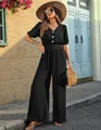 Elegant black short-sleeved gathered-waist jumpsuit with wide-leg design and white buttons - S / Top And Bottom / Black