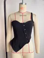 Close-up of a black one-shoulder corset crop top with irregular hem and hook-and-eye closure - S / Tops / Black