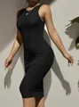 Close-up of black sleeveless rib-knit bodycon midi dress showing fine fabric texture - S / Top And Bottom / Black