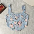 Light blue floral print corset tank top with decorative boning detail on plush background - XS / Tops / Light Blue