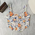 Front view of a white floral print corset top with a vintage square neck design - XS / Tops / Orange Red