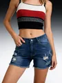 Detailed front view of stylish distressed blue denim shorts with frayed edges on model - S / Bottoms / Dark Blue