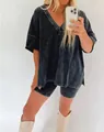 Close-up of women's charcoal acid wash V-neck t-shirt and matching biker shorts set - S / Top And Bottom / Black