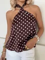 Close-up shot of an elegant brown and white polka dot halter top in silky satin fabric - XS / Tops / Brown