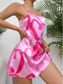 Close-up detail of a pink satin slip nightdress featuring artistic heart brushstroke prints - S / Tops / Bright Pink