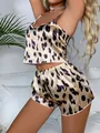 Detailed view of women's leopard print satin cami pajama set with silky texture - S / Top And Bottom / Leopard Print